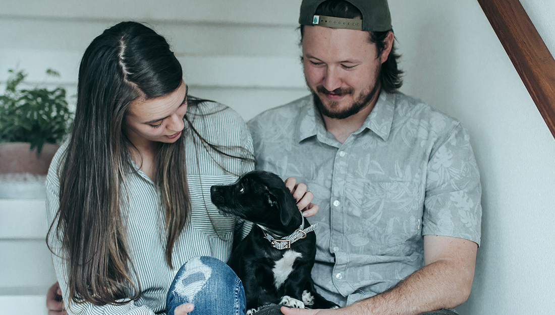 couple at home with dog